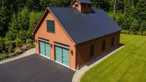 Veteran-owned exterior painting crew on ladder in Sunapee NH