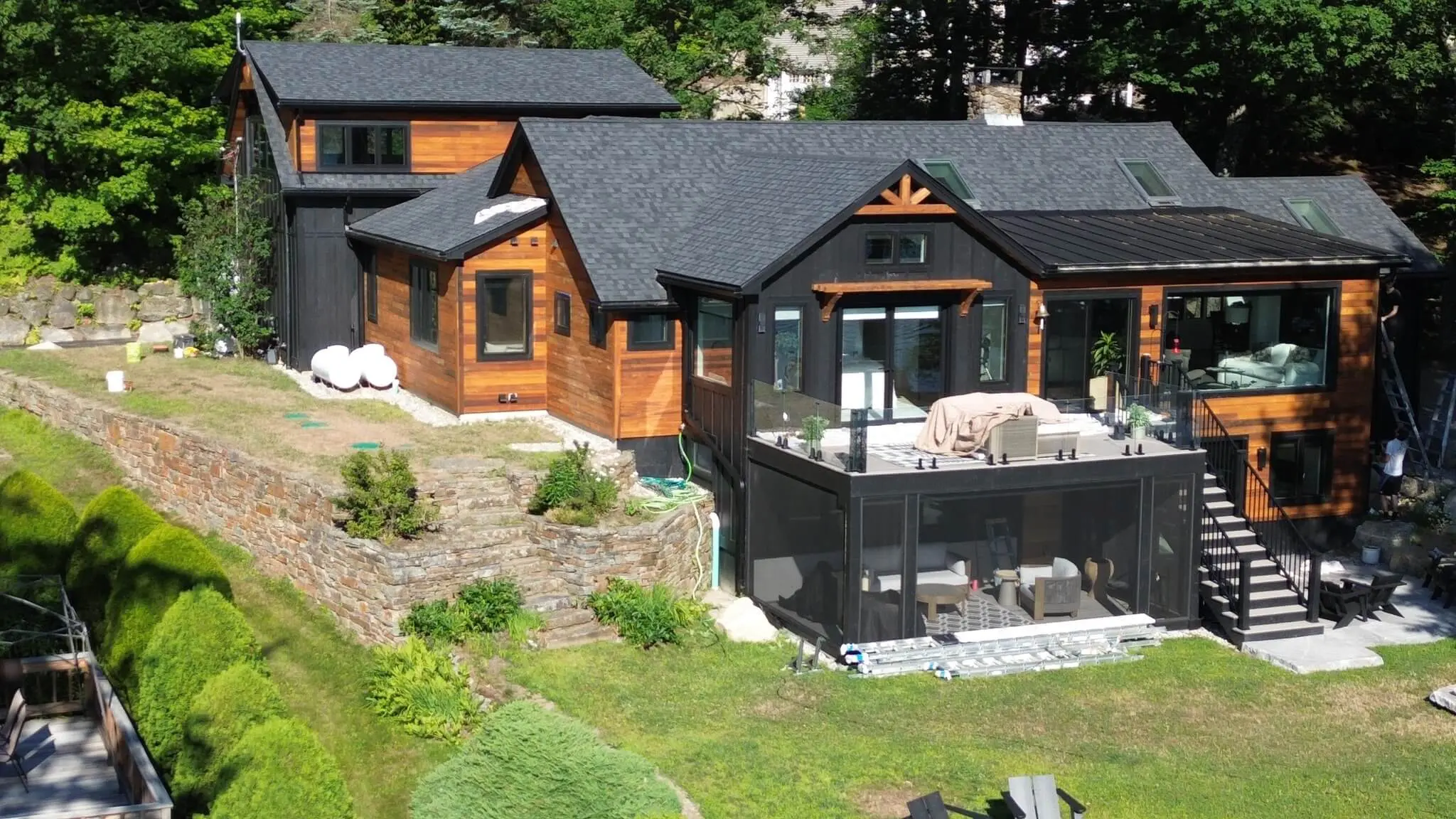 Exterior house painting with crisp trim in a Sunapee NH wood whole house