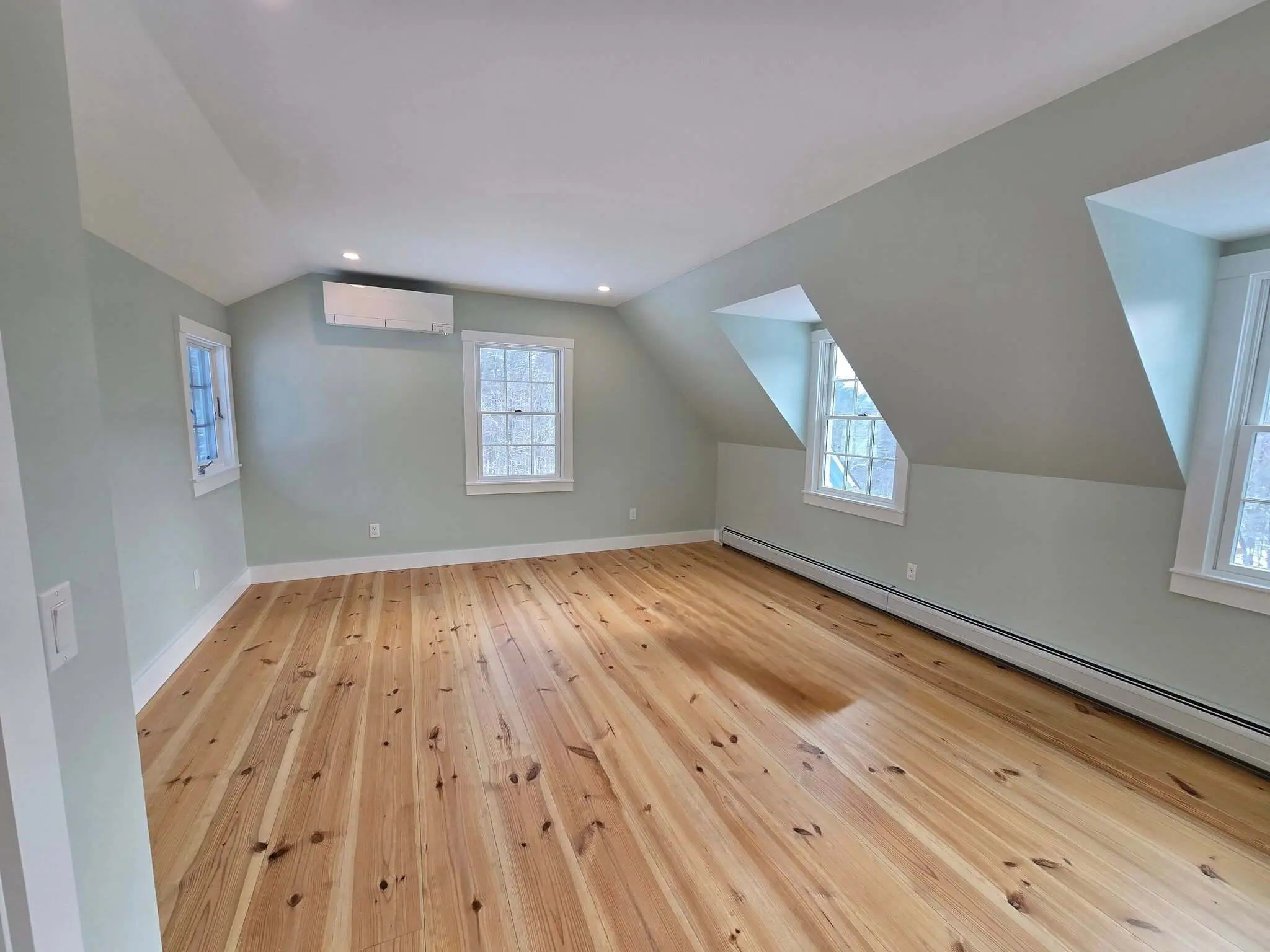 Interior painting in a Sunapee NH bedroom with soft sage green walls