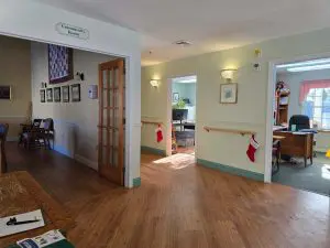 Commercial painting in a Sunapee NH assisted living facility with pale green walls
