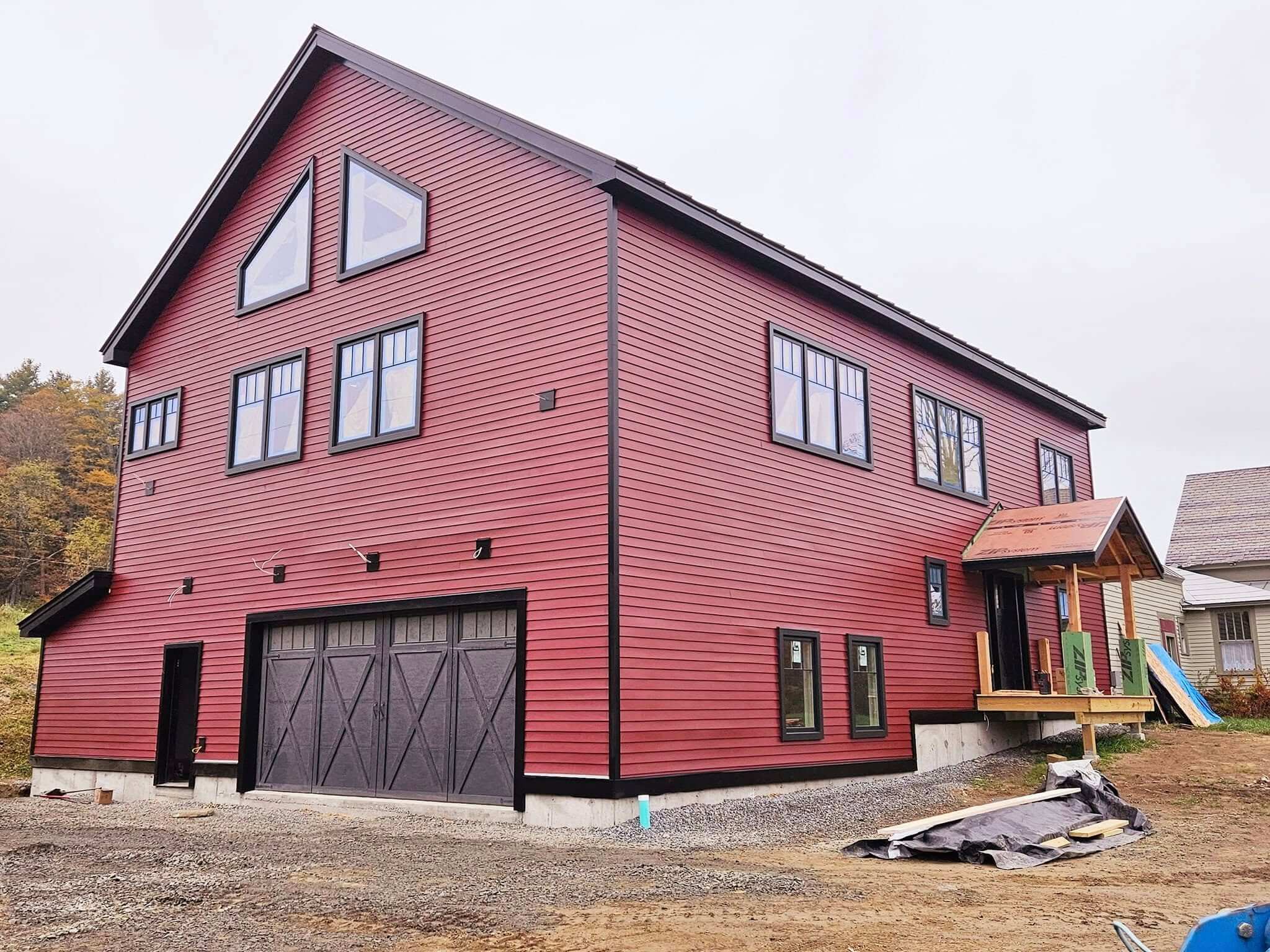 Exterior house painting with crisp trim in a Sunapee NH whole house