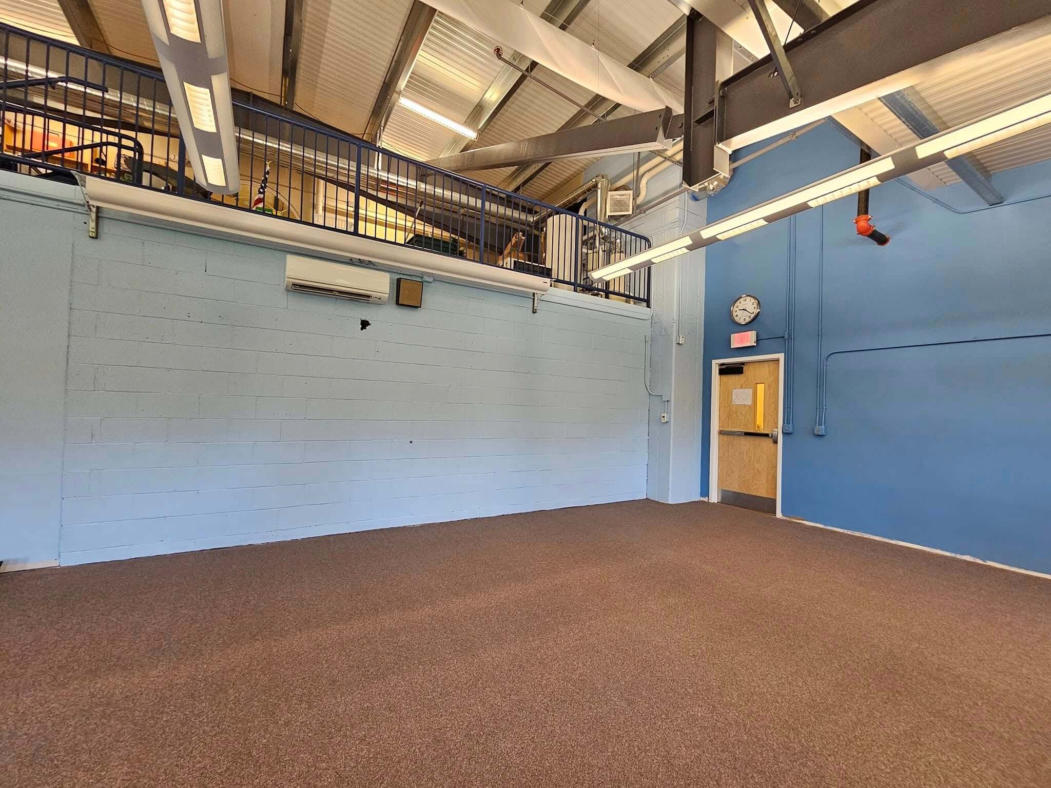Commercial painting in two-tone light and dark blue with high ceilings